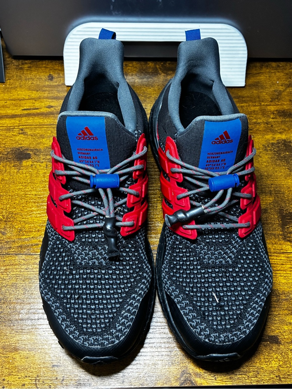 adidas Men’s Black Knit Athletic Shoes with Red Cage & Blue Tongue